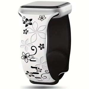 Black and white floral-patterned smartwatch band on a white background